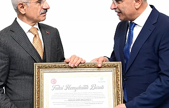 Bakan Uraloğlu'na Başkan Er'den Fahri Hemşehrilik Beratı